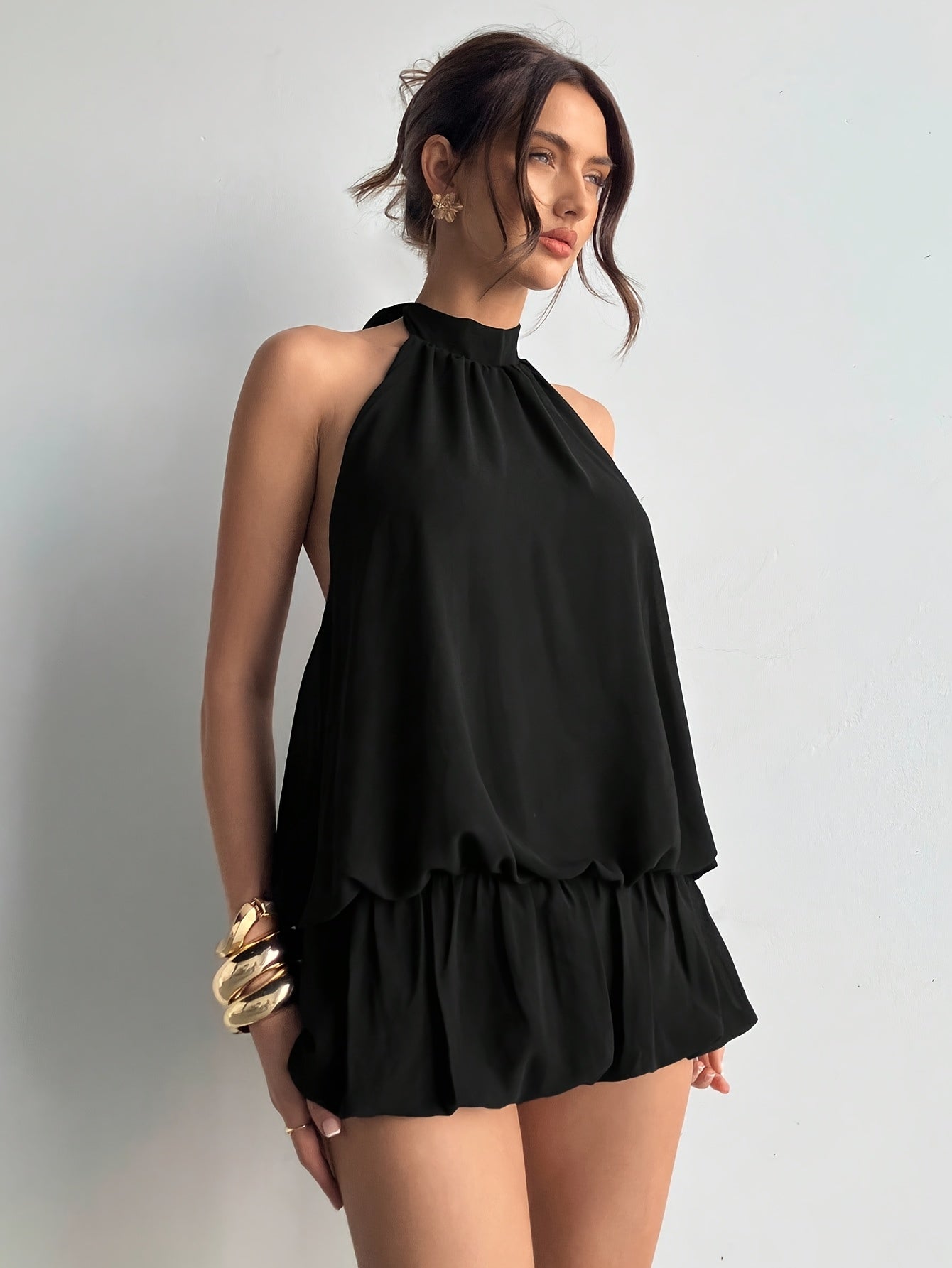 Elegant Black Halter Jumpsuit for Women with High Neck Sleeveless Ruffle Hem Cocktail Style