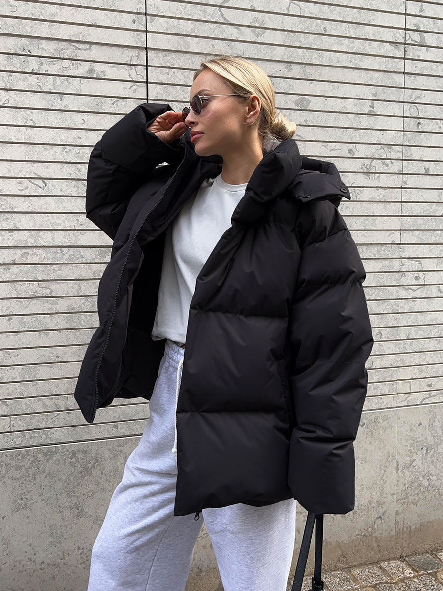 Warm Black Hooded Puffer Jacket for Women with Zip Front Side Pockets Relaxed Fit Insulated Cold Weather Style
