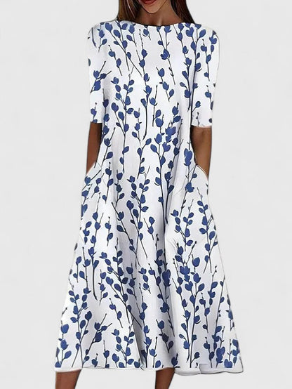 Effortless Floral Midi Dress for Women with Round Neck Elbow Sleeve Pocket Flowing Casual Style